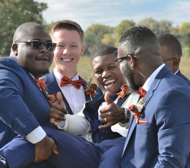 Groom having fun with Groomsmen by Lance Albers