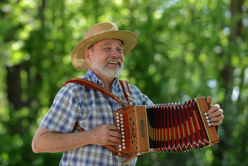 Mikkel Thompson plays his accordion at a party, Fergus Falls, Minnesota