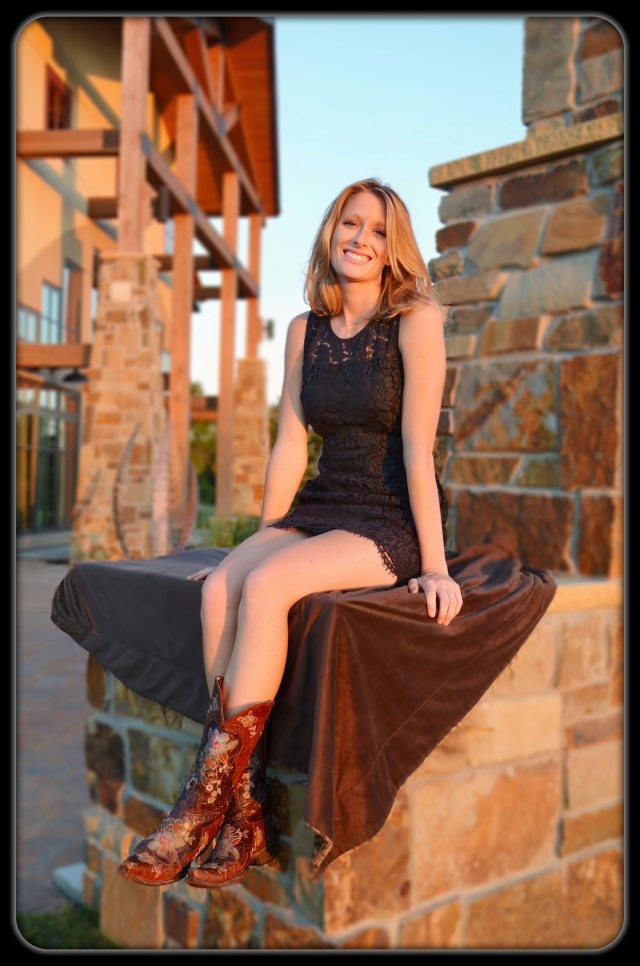 Portrait of young woman in her fancy cowboy boots (Photo by Lance Albers)