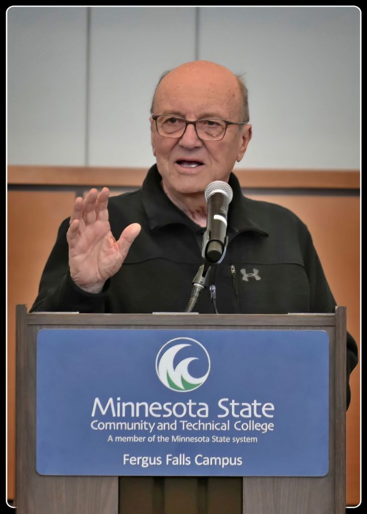 Gary Spies speaking at the podium in Legacy Hall on the Minnesota State Community and Technical College M State Fergus Falls Campus.