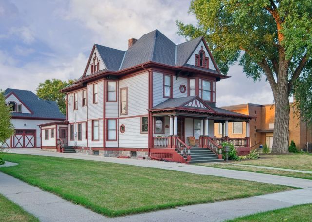 Exterior architectural photography by Lance Albers of the historic 1899 home on W. Cavour Ave in Fergus Falls, showcasing a new paint job by Don Martin of Big Boys Painting.