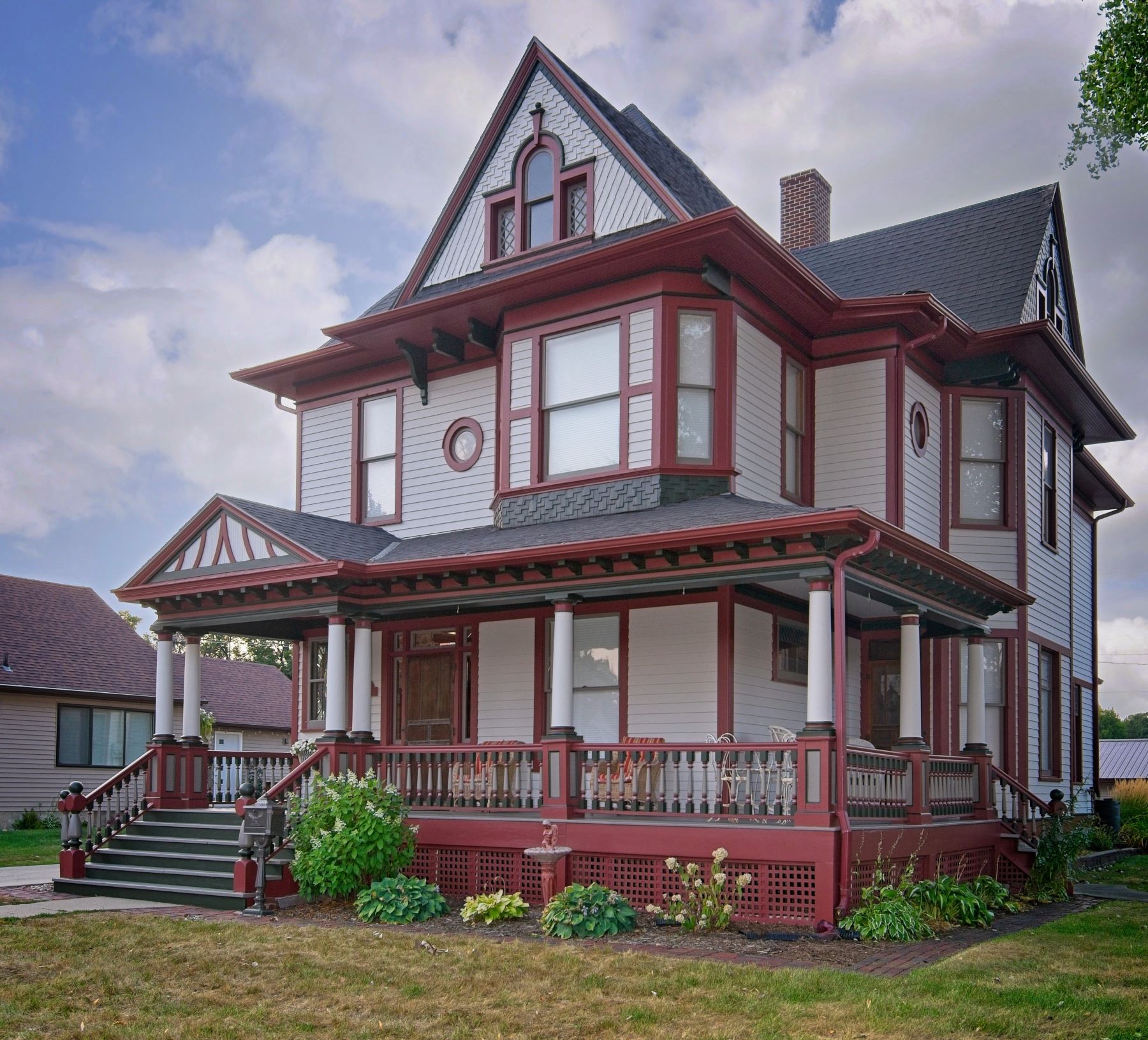 Front corner view of the historic 1899 home on 504 W. Cavour in Fergus Falls. Photographed by Lance Albers to show off the recent beautiful paint restoration work by Don Martin of Big Boys Painting.