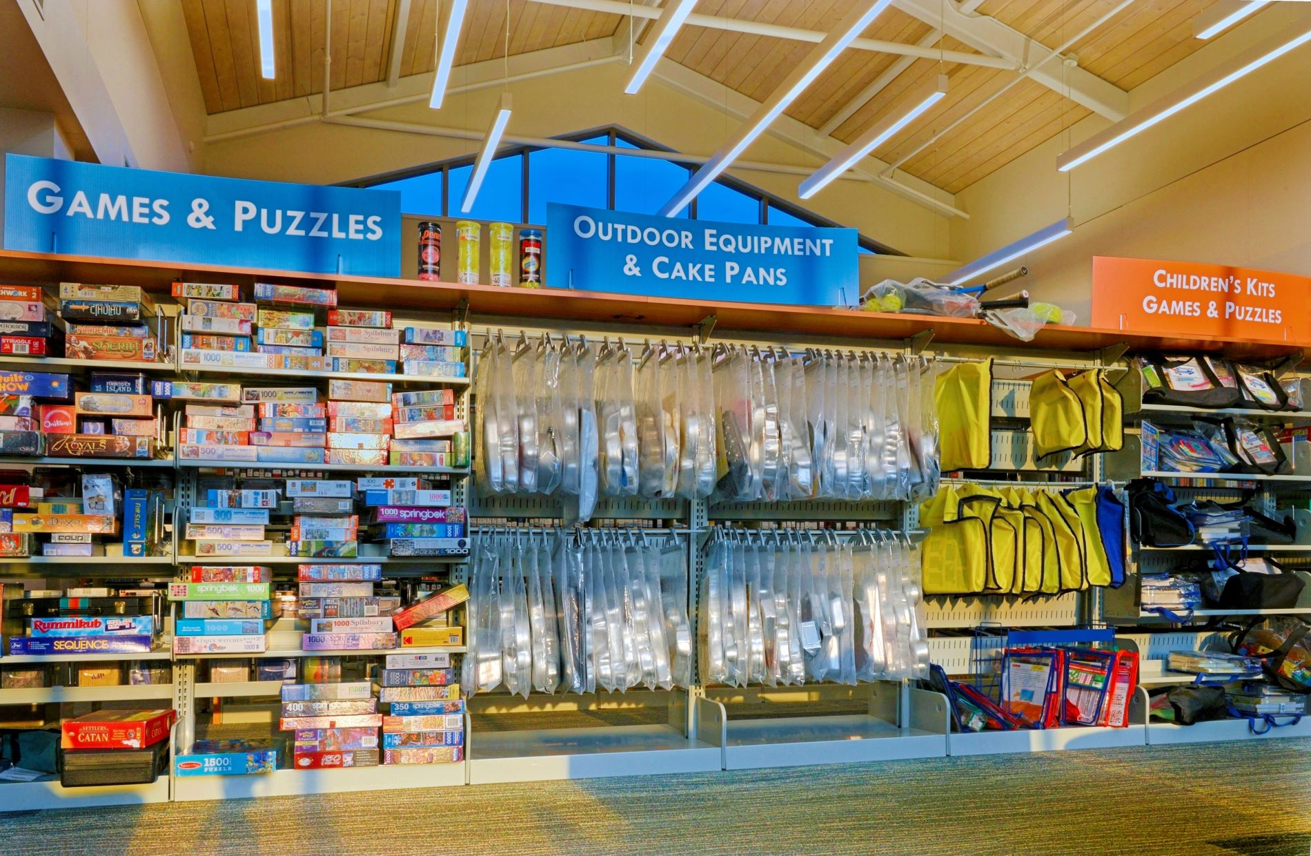 The "Library of Things" special collections section at the Fergus Falls Public Library featuring shelves of board games, puzzles, and baking pans.