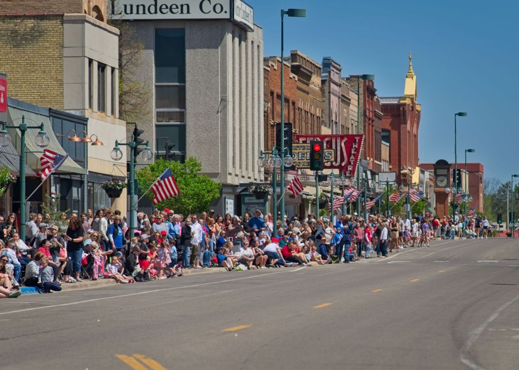 Packed crowd watching the Chris Tungseth Day parade along downtown Lincoln Avenue in Fergus Falls Minnesota.